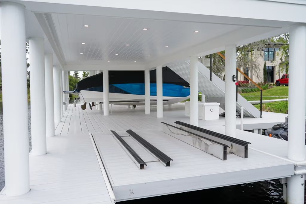 Inside a composite boathouse with lift bunks and recessed lighting