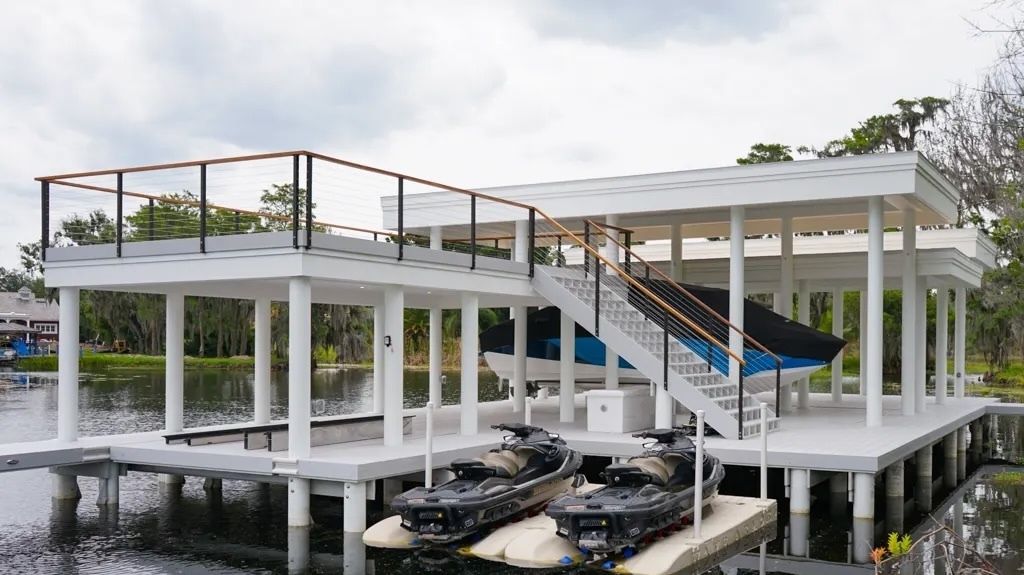 Composite boathouse with stairs to a rooftop deck