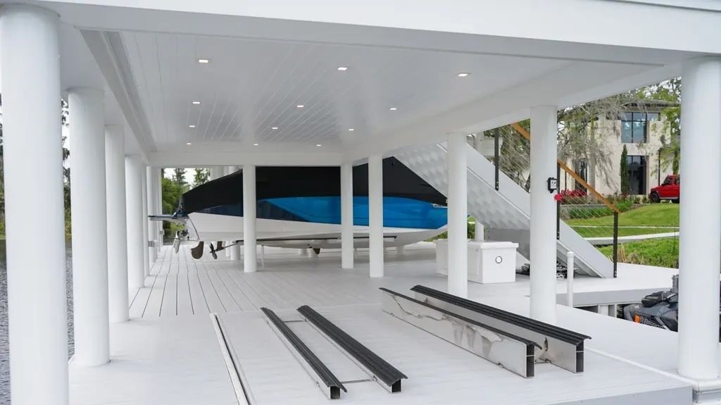 Upper deck of a boathouse with cable rail and wood cap