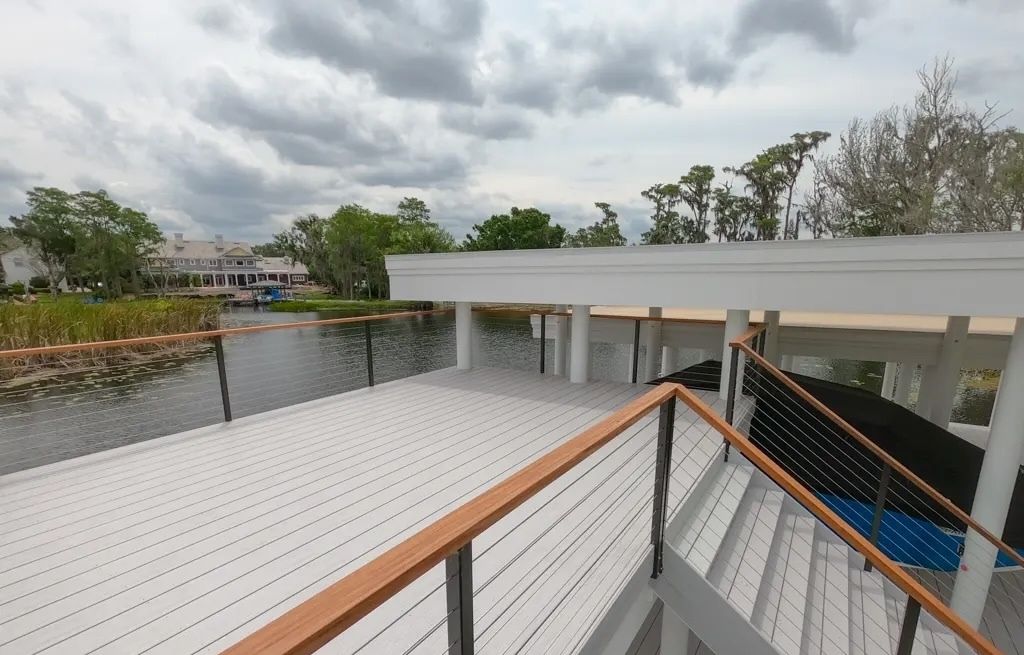 Rooftop deck with cable rail over a boathouse