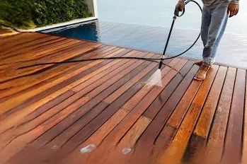 Pressure washing a wood deck