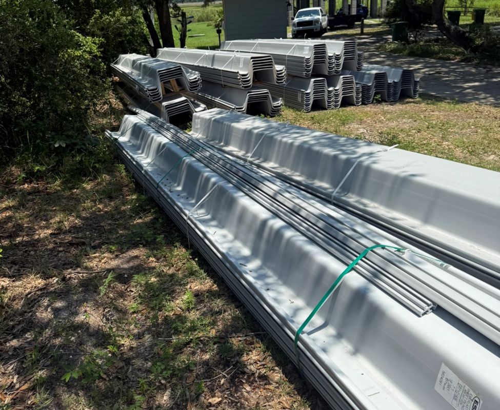Everlast vinyl sheet piling staged on a job site