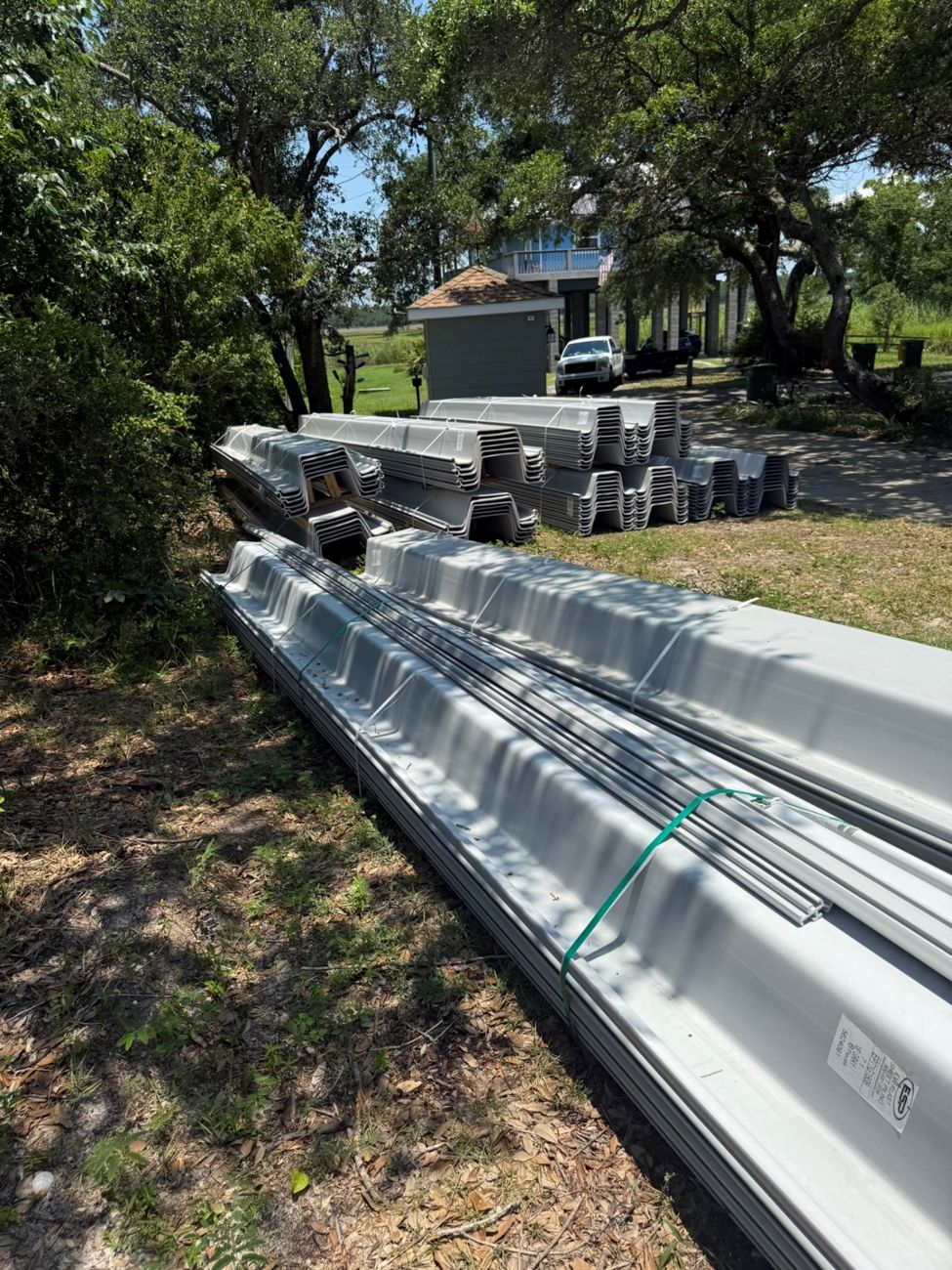 Everlast vinyl sheet piling staged on a job site