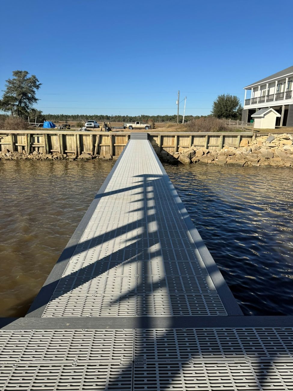 Flow-through decking dock over the water