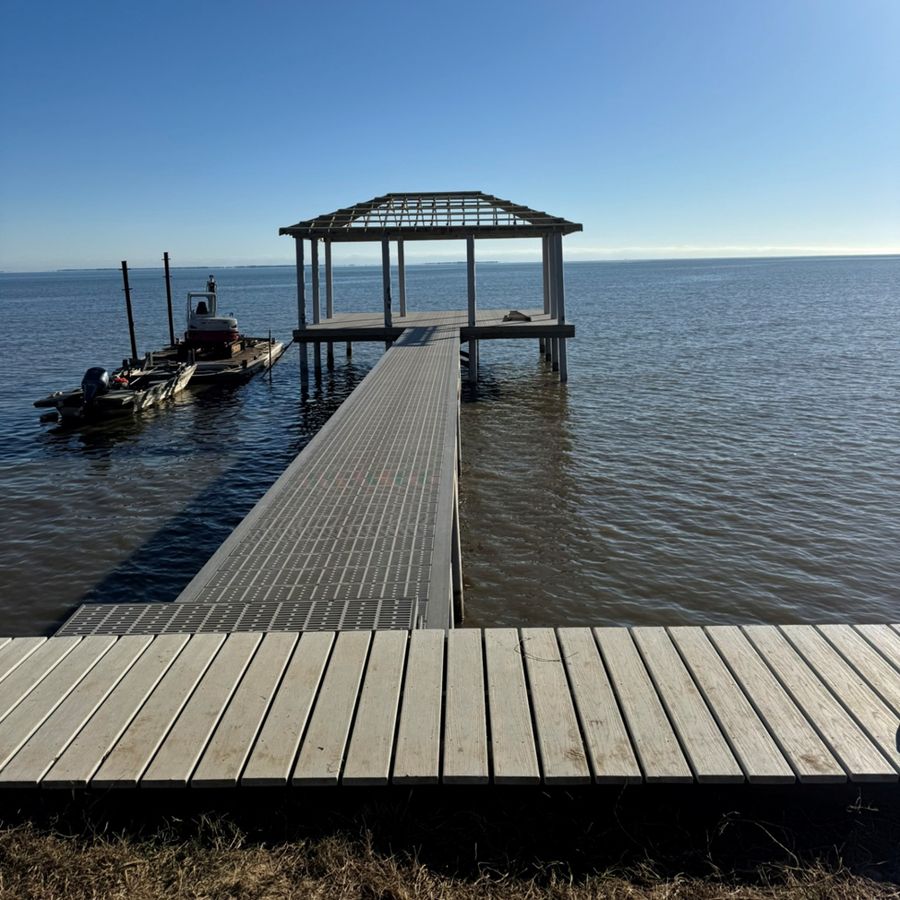 Walkway and roof: Flow-through decking down, roof framed on the platform.