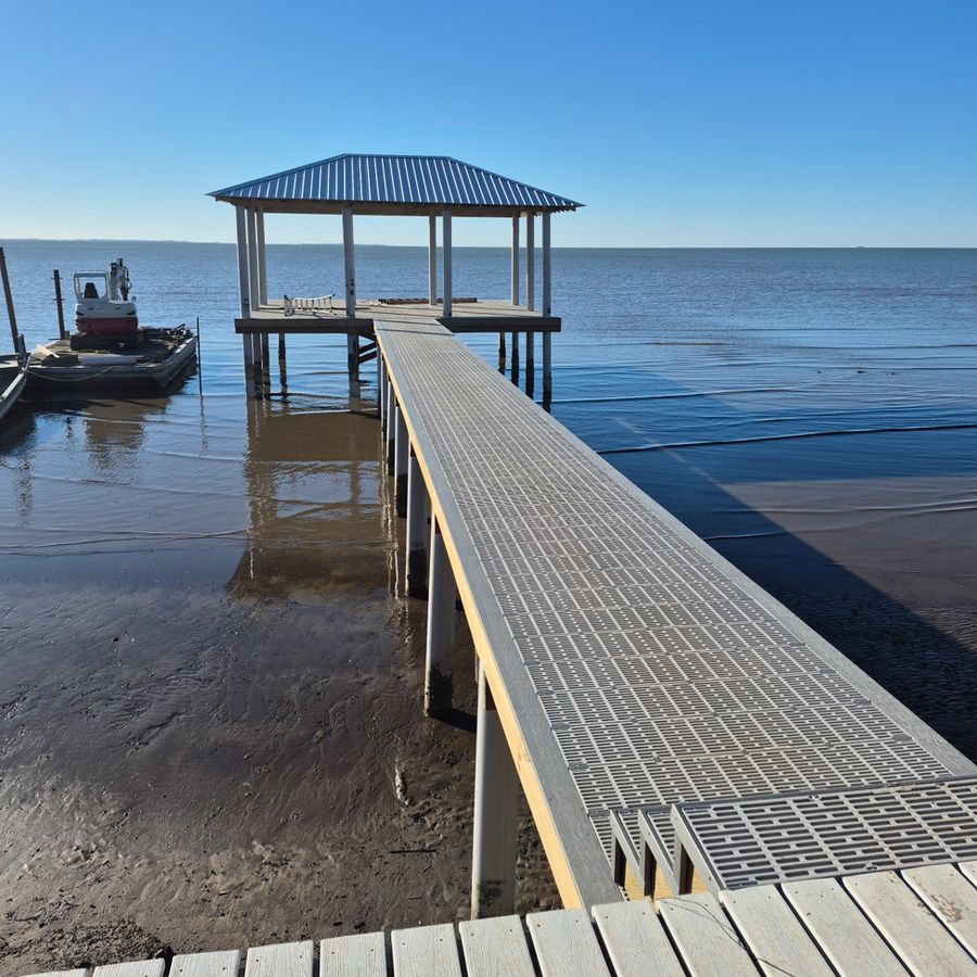 Finished: Metal roof on and a pier built for open water.